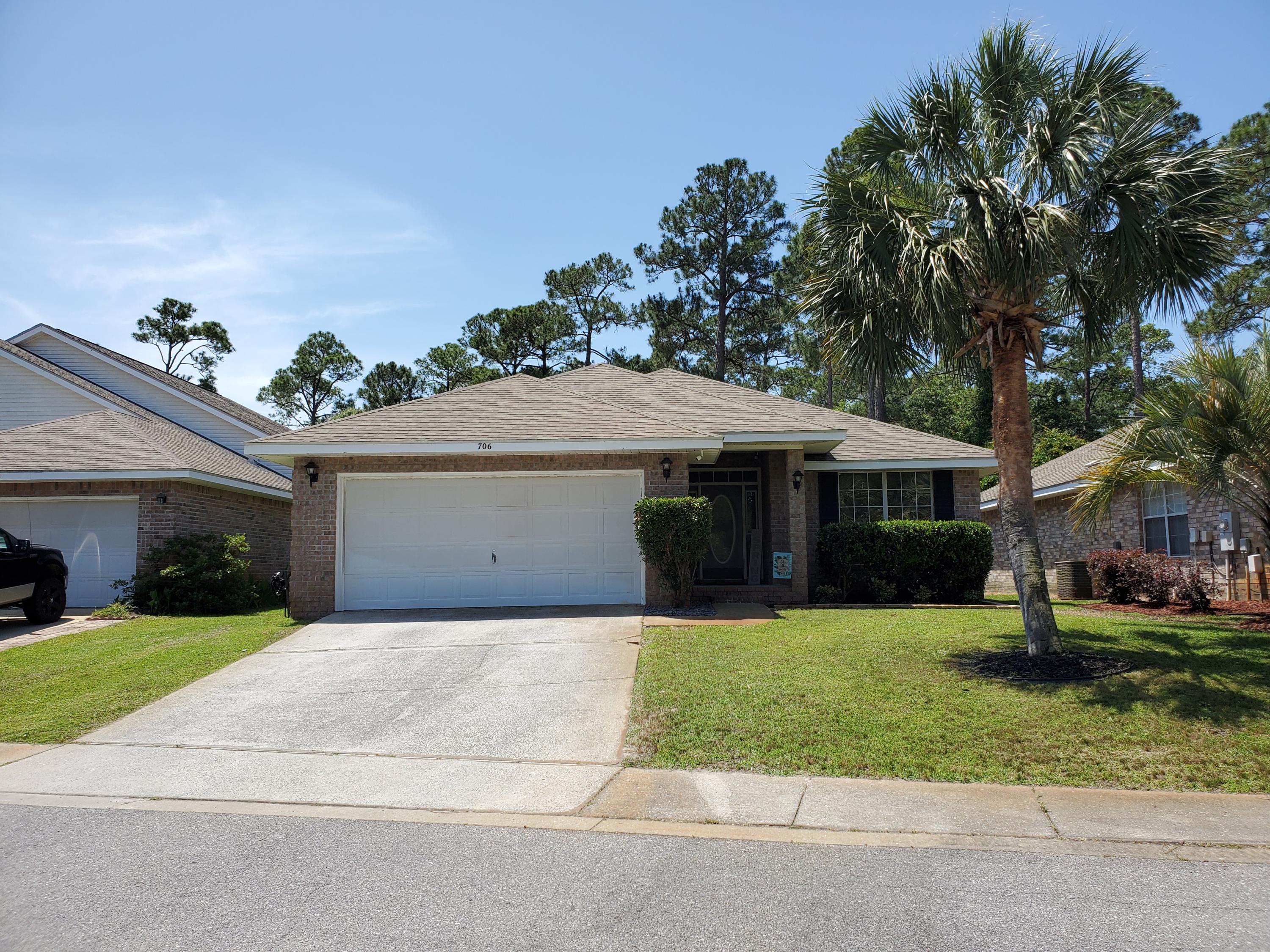 Beautifully updated open floor plan home. Set in the private friendly neighborhood of Marsh Harbor. Tall vaulted ceilings in great room, kitchen and dining area. All new flooring, quartz kitchen countertops, disposal, chalkboard wall, sink/faucet, shiplap bar, and light fixtures. New wood laminate flooring in all living space including front office, new carpet in bedrooms, new toilets and tile in bathrooms. New light fixtures in all rooms. All new interior paint including a black chalkboard wall in the kitchen. New smart thermostat, Arlo security system, and rainbird sprinkler system. Access to boardwalk and dock into the Santa Rosa Sound. Interior laundry room in between kitchen and garage. Front office area with a gorgeous front view of the center retention pond; also has a closet and