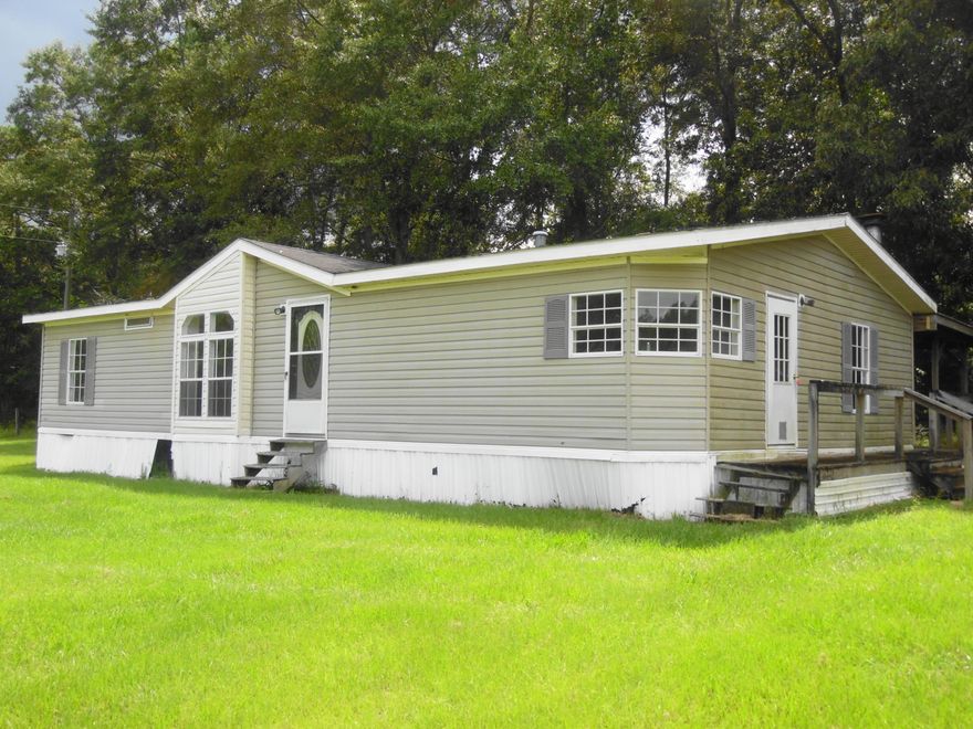 Bring those horses! 13.5 acres with pasture and a branch, a 1400 sq. ft. 1995 manufactured home and horse barn....Property adjoins Ten Lakes Estates. Shared road needs some work. Front and back pastures. Will be eligible for FHA and VA financing.