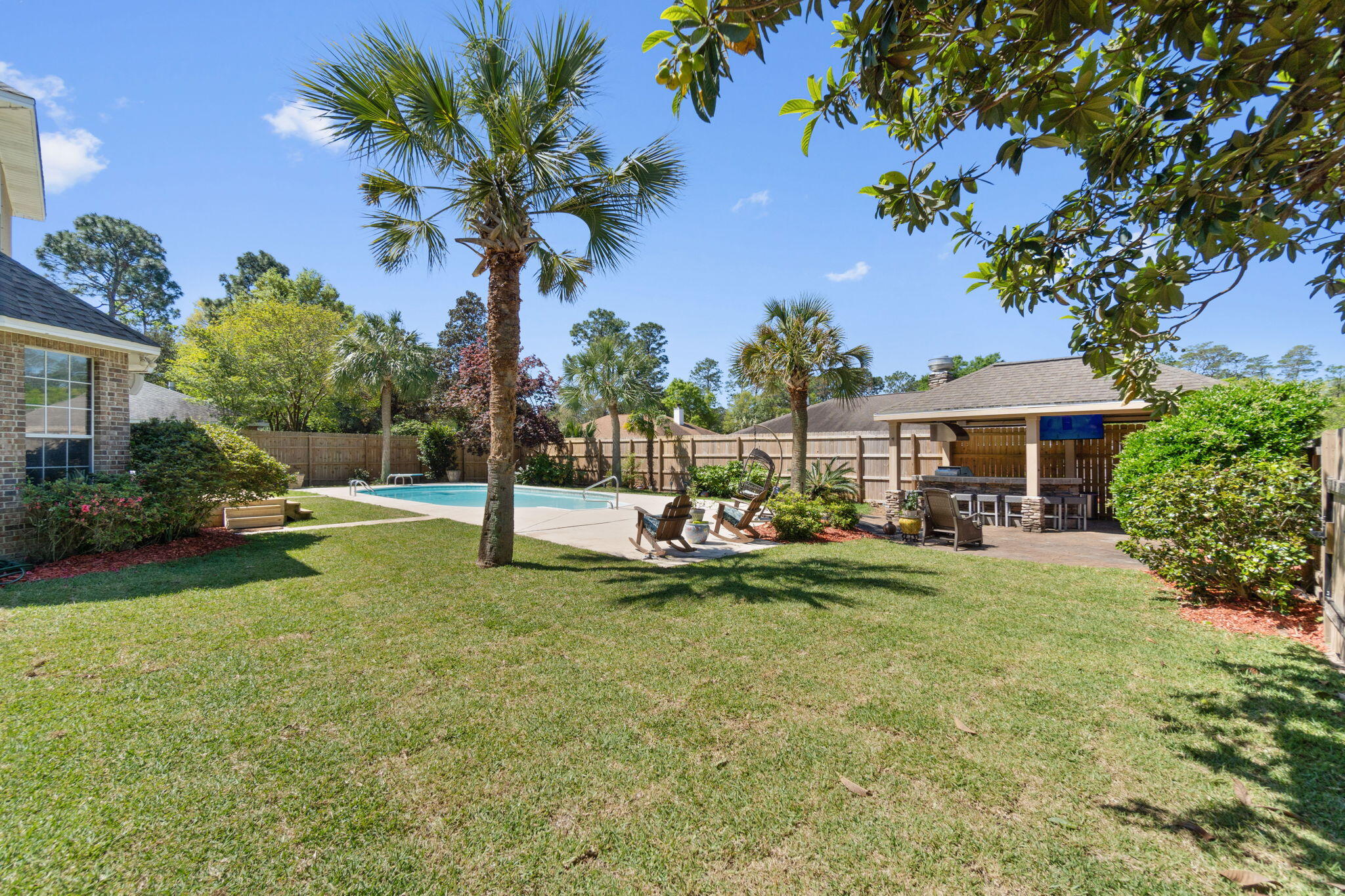Located in a highly desirable neighborhood with large lots, this home offers easy access to shopping, dining, parks, and top-rated schools. One of the highlights of this home is the outdoor oasis. Step outside to discover a resort-style pool surrounded by lush landscaping, creating a private paradise for relaxation and entertainment. The outdoor kitchen is a focal point, complete with a grill, sink, ice maker, dishwasher, and bar seating, making it ideal for hosting summer BBQs or al fresco dining. RV hookup and parking pad are located behind the fence with a rolling gate. Huge shed with power would make a great workshop. Located on a corner lot with approx 0.38 acres. Inside you will find travertine and bamboo flooring throughout. Downstairs master suite with whirlpool tub and...