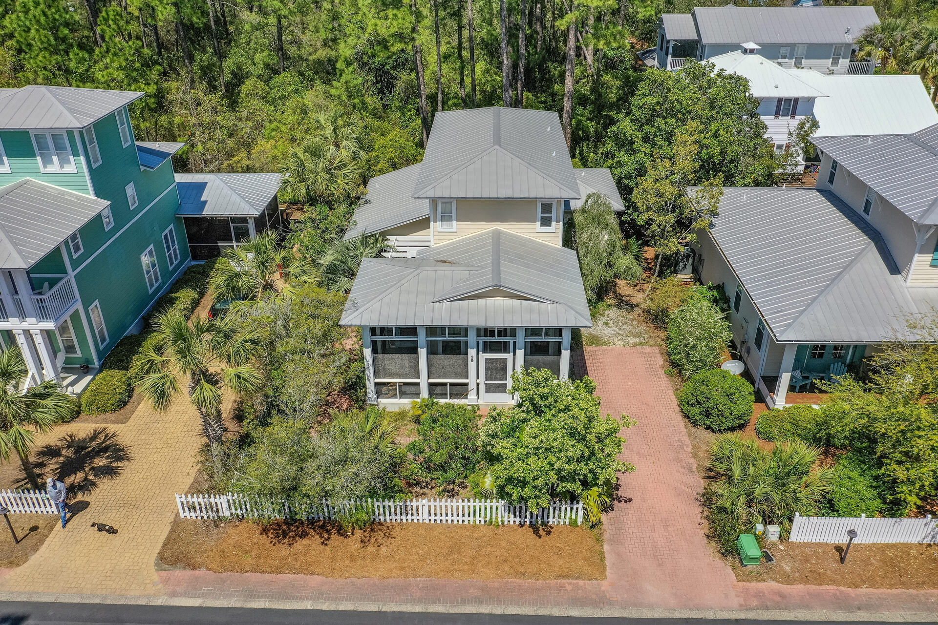 This charming Florida style cottage is located in Cassine Village in popular Seagrove Beach. Upon arriving you are welcomed by an inviting front porch overlooking a manicured landscape. Upon entering the home you will find an open floor plan, a living area, dining area, hardwood flooring, breakfast bar and an additional screened porch off the dining room. The Master suite is located on the first floor. Two bedrooms, a full bath, custom bunk room and a separate living area are all located on the second floor. This beautifully designed home allows for plenty of natural lighting, with an indoor/outdoor living concept and is located within walking distance to 2 beach walkovers, 2 pools, tennis, hiking and fitness trails surrounded by twisting oaks and massive cypress! This home is a must see!