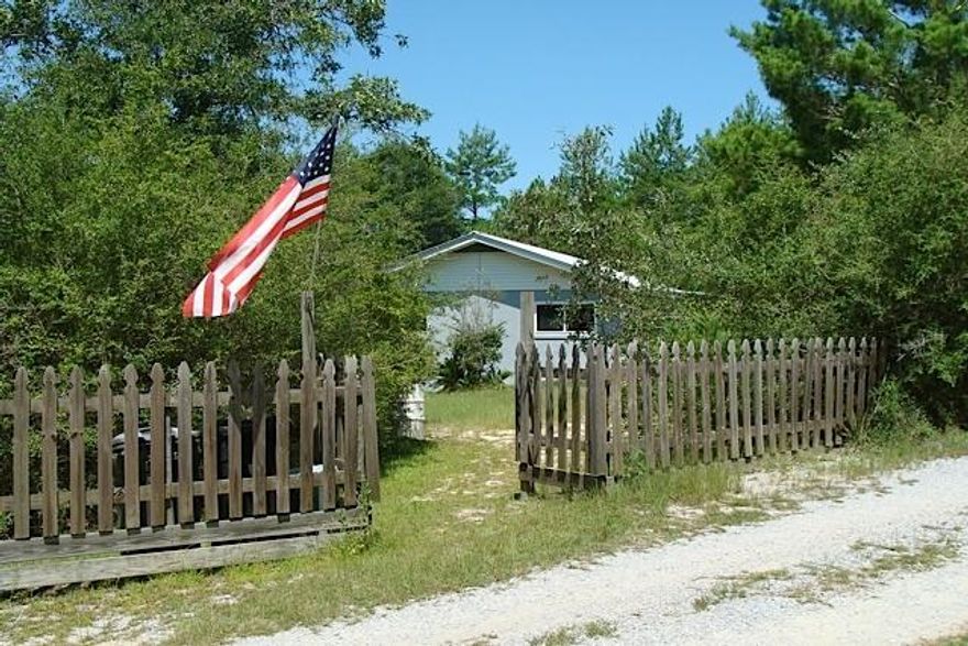 PRICE REDUCTION! Bring us an offer. It's hard to find a reasonably priced home located south of I-10. This 3BR 2BA home on 3.6 acres is a perfect getaway for those who live in North Walton County but work in Freeport or S. Walton. NEW well pump & septic system! This stucco home is in excellent condition. Open & airy floor plan, ceramic tile floors, pretty kitchen w/ newer cabinets, easy-clean vinyl windows, and deep marble windowsills in all rooms. Metal roof in 2010, and 2 outbuildings for all your storage needs. Ample parking, a front covered porch and large back deck complete this well-built home that's private & secluded yet convenient to everything.The 3.6 acres is in 3 parcels. Seller says the other 2 parcels are buildable (subject to verification by Buyer at Buyer expense).