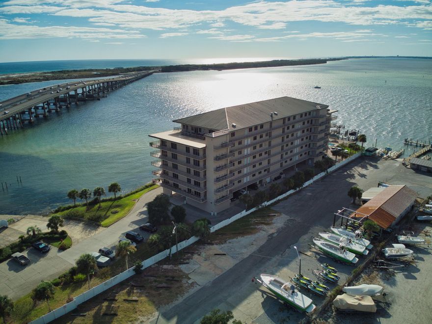 This luxury waterfront condo is located in the heart of Destin in a gated condominium. Comes with 40' boat slip basically on Crab Island!! The views from this large balcony are incredible! Spend the mornings watching the boats go out, the day watching the always entertaining Crab Island crowds, and spend your evenings fishing off the docks. This 3 bedroom 3 bath 2200 SF condo is full of upgrades. Including but not limited to crown molding, raised ceilings, recessed lighting, granite countertops, stainless steel appliances & wet bar. The oversized master has direct access to the balcony. So you can watch the boats go out from your bed if you want. The best restaurants and shopping Destin has to offer is only a short walk away.