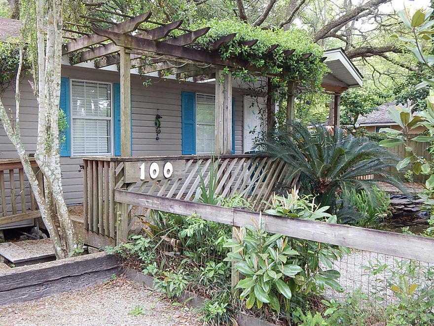 The little Dragonfly House is nestled among palms, oaks, arbors and a fish pond. Peaceful setting for the current owners' vacation abode. You have to see it to appreciate it. The sellers are in town off and on so please call for an appointment. The pictures look nice but it is one you must see to truly appreciate. Three lots on adjoining street just sold to a FWB builder who is planning to build new homes. Buyers to verify all information.