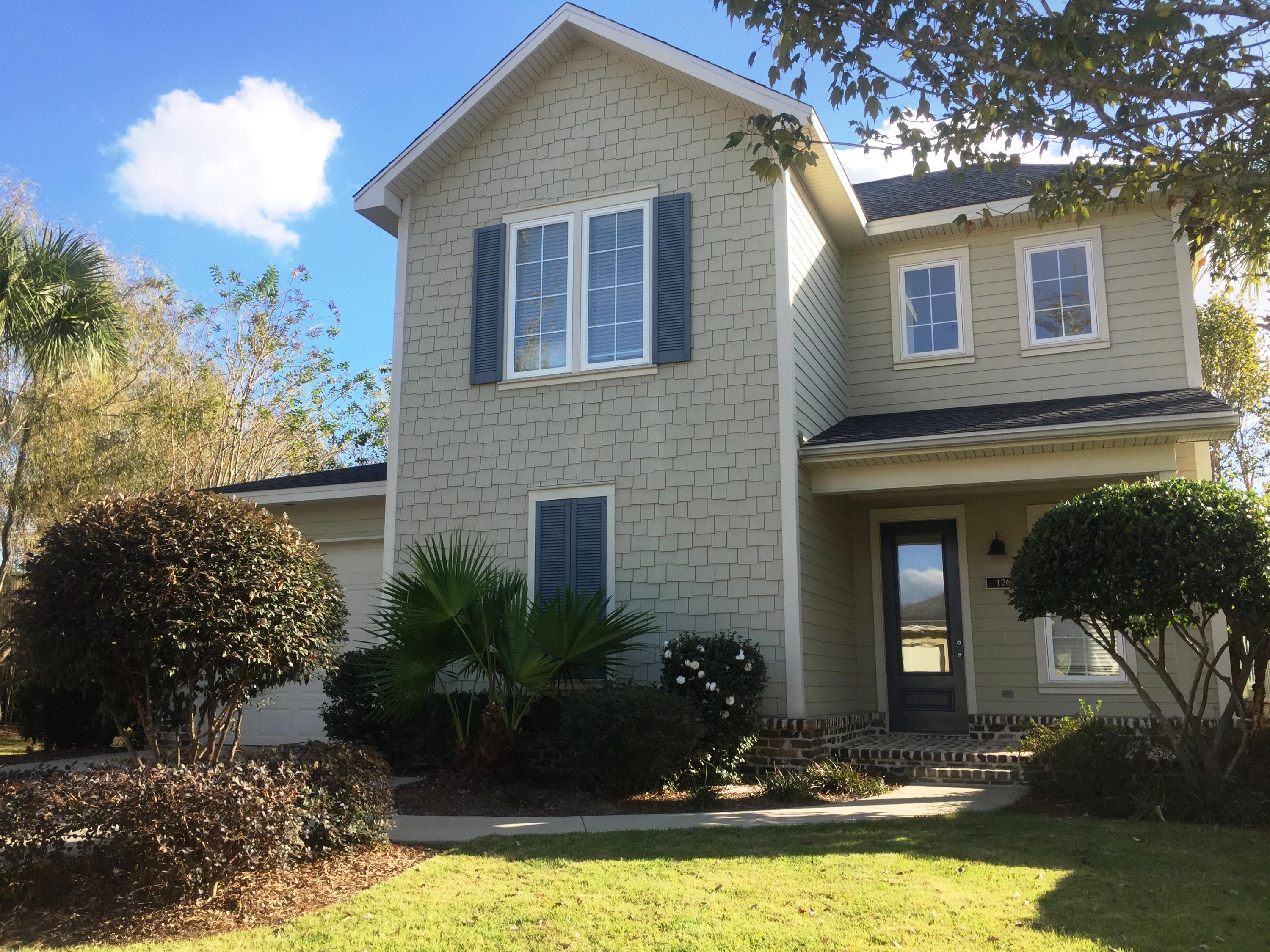 Beautiful turn-key home in coastal community & just minutes from the beach. This well-kept house boasts 3br, 2.5bth, one car garage & a large screened porch. Home is located on a premium lot, across & adjacent to the manicured common area w/paved walkway to clubhouse. Includes privacy fence to the back of the home which runs the length of property. Open floor plan w/spacious kitchen w/granite countertops and 11'ft breakfast bar, all-wood cabinetry & stainless steel appliances. 1st floor Master and 2 large bedrooms w/a shared bathroom upstairs. Other features include: BRAND NEW A/C, freshly painted interior, 9'ft ceilings & 8'ft doors throughout, recessed lighting, tiled main areas & bathrooms, hardwood stairs, casement windows and reclaimed brick accented porches. As a bonus, HOA maintains