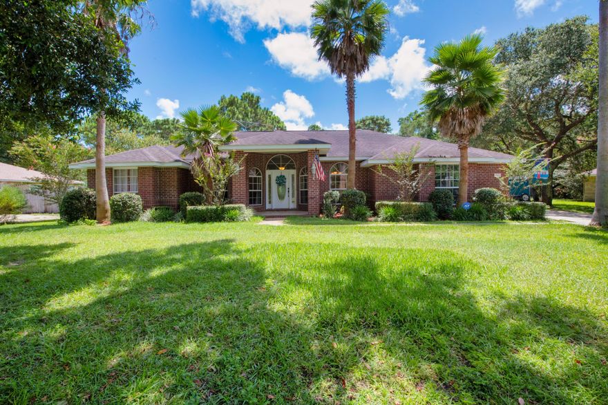 NEW ROOF !!!! Beautiful Custom Built Home in Holley by the Sea. This home offers Solid Oak Wood floors throughout the home with tile in the bathroom and laundry rooms. Relax in your own fenced in back yard with your own in-ground pool , screened back porch overlooking pool area. Need extra storage , Man cave, or even a she shed?  16 x 14 Workshop sits on the back of property. The Large kitchen Is equipped with beautiful oak cabinets, breakfast bar, breakfast nook, and a formal dining room. The master suite offers double walk-in closets in bath, tile floors, garden whirlpool tub, separate shower and more! With two extra large bedrooms and another full bath, you can keep the office as an office or turn it into another bedroom or create a room to fit your needs. If this was not enough keep you entertained, other than being nestled in a nice location , this home is in a great community that offers a community clubhouse, community pool, beautiful Green Golf turf, Recreational activities such as swimming, boat launch, fishing, BBQ, dock, Exercise room, game room, playground, sauna, tennis, but also provides a short drive, approximately 15 minutes to Navarre and Pensacola Beach.