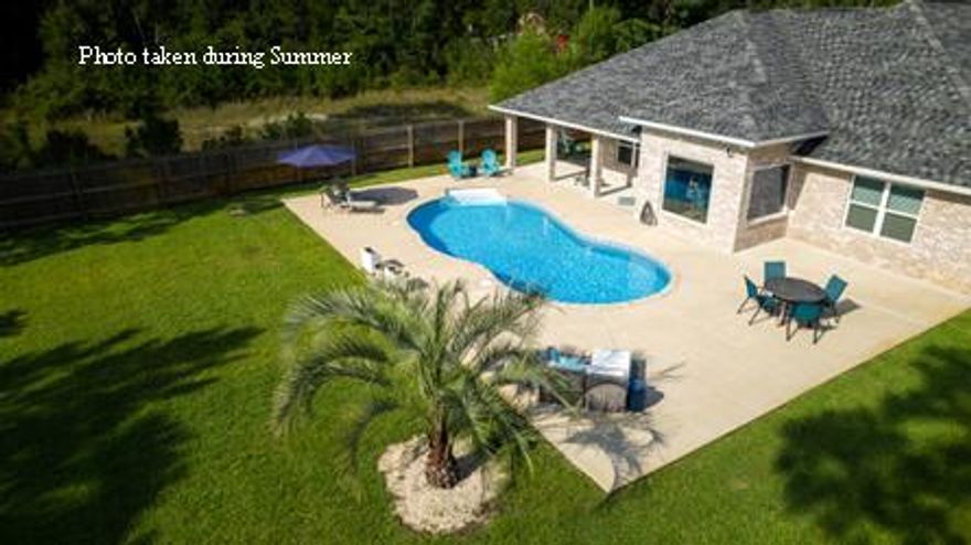 ~ONLY 4 MILES to the BEACH and Less than 1 Mile to East River Boat Ramp!~ Beautiful 2018 Built Craftsman Style Home w/Saltwater Pool in FAST Growing Navarre, Florida! Upgrades & Features Include:  Salt Water Pool / Large Covered Patio & Outdoor Entertainment Area / 4 Bdrm / 2 Bath / 2 Car Garage / Oversized Parking for Cars & Toys / Granite Counters / Kitchen Island / Breakfast Bar / Stainless Steel Appliances / 2 Walk-In Pantries / Trey Ceilings / Wood Look Tile / Hurricane Protection / Brick Exterior / Hybrid HWH / Sprinkler System & Lawn Pump/ No HOA. The Master Bathroom has Double Vanities / Tiled Shower with Rain Shower Head / Garden Tub / Large Walk-in Closet.  The Large Laundry Room has entry into the Master Closet for your convenience and includes Washer & Dryer.  Ideal Location.. close to Shopping / Restaurants and only 4 Miles to the most Beautiful BEACHES on the Emerald Coast and all the FUN this area has to Offer.  Boat Ramp access is less than 1 Mile away with EASY access to East River and East Bay! Don't miss your chance to Purchase your Own Little Paradise in "Florida's Most Relaxing Place"! Buyer to Verify all Dimensions and Info.