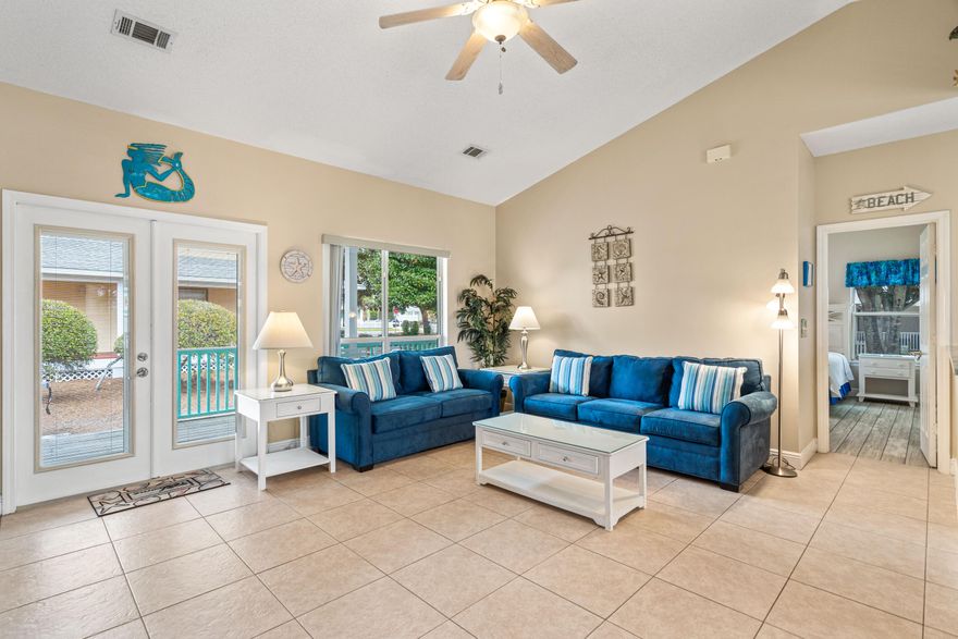 New roof! This updated 3 bedroom beach bungalow is what you have been looking for! The tropical colors of the house and new landscaping welcome you. Enter the front door to the open floor plan and vaulted ceilings. The dining room is accented by a bay window and is open to the kitchen. New wood look tile in all of the bedrooms and new kitchen cabinets and granite countertops. Enjoy sitting on the back or front covered porches watching the sun melt away. Great private back yard. This home is directly across the street from the community pool, after enjoying the pool, take a short stroll down the street to the beach. This is a great rental property or primary home! Hurricane shutters included.