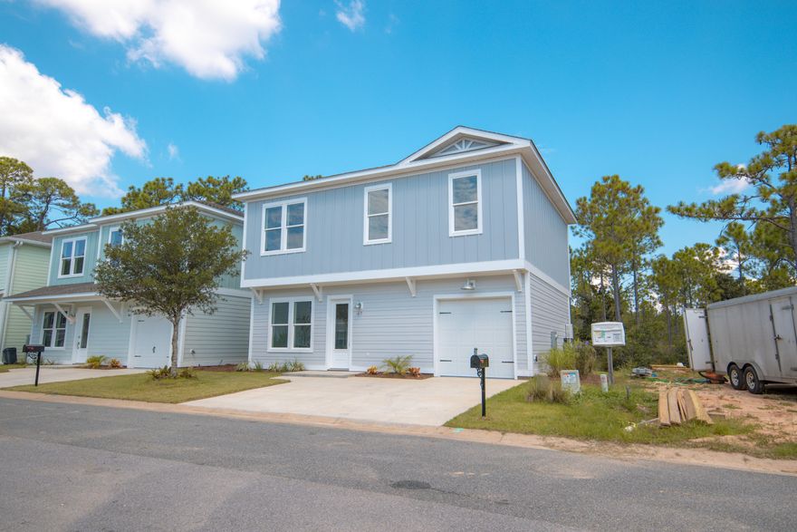 Coastal Living at its finest. This beautiful house has an open floor plan with three bedrooms, two full baths and a half bath. The spacious Master Suite has trayed ceiling with spa-like bathroom and an enormous master closet. Kitchen has fantasy brown granite with stainless steel Kenmore appliances, accented with two-toned shaker cabinetry. Cabinet doors and drawers are soft close. The upgraded full extension drawers feature durable dovetail construction. Each bedroom has four cans and a fan. This house sports a 245 sq. ft. outdoor deck that overlooks Point Washington State Forest. This gem is located south of US 98 and just over a mile from the sandy white beaches of the Gulf of Mexico.