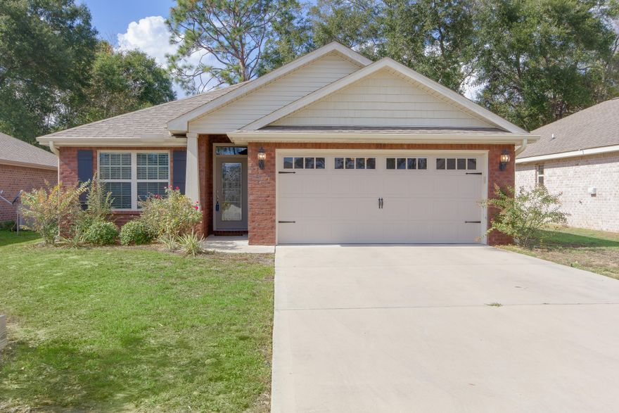 This almost new, cozy home is set in the heart of Crestview. The craftsman style with its all brick exterior makes this charming home a must see. This home is also highly energy efficient and certified a Earth Cents Certified Home'. As you walk into the home via the quaint porch, you will enter the spacious living room with high ceilings and an open concept floorplan. The open floorplan offers clear views of the gorgeous kitchen, large dining area and backyard from the living room. As you approach the Kitchen you'll notice the Granite counter tops, high end stainless steel appliances, Pendant lights above the raised counter and, lovely tile back splash. Just off the dining area is the large master bedroom featuring 9' ceilings and crown molding giving it an airy feel.