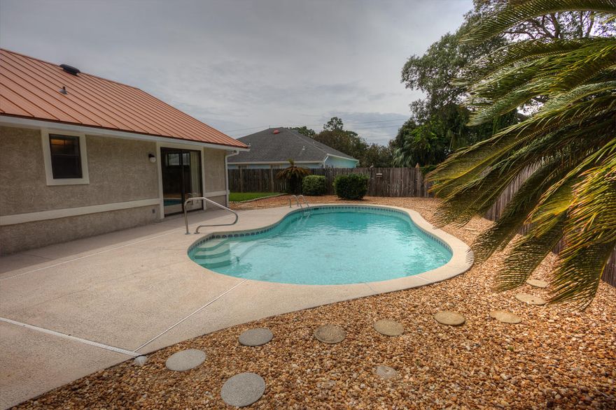 This hime shows pride in ownership. Very well maintained home with unground pool, awesome metal roof, newer septic system,Florida room, wood burning fireplace, security system. No HOA fees, sprinklers in the front yard. Close to Lagoon & Beach.
