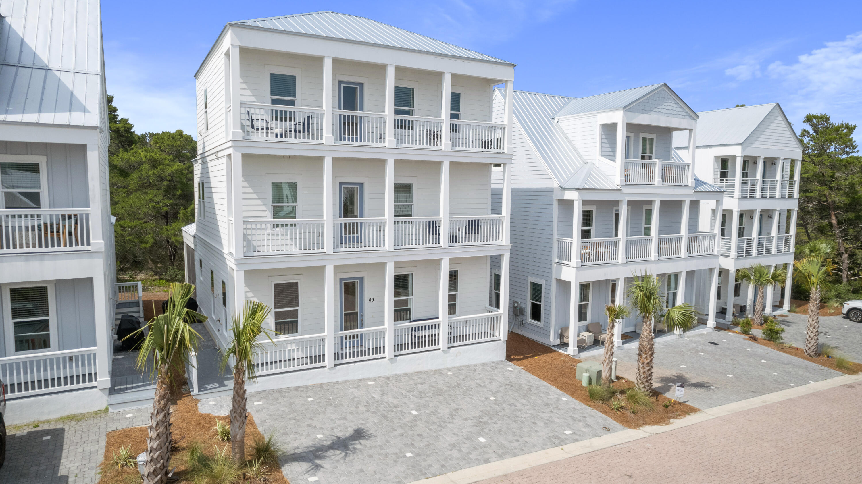 Now Priced WAY below Appraised Value!!Welcome to 'Sunset Villa'! Fulfill your beach life dreams from this lovely, like-new, three-story home backing to the privacy of conservation land. Offering 4 bedrooms, with an additional oversized bunk space on the second floor, and an extensive recreation space with a kitchenette on the third floor, while hosting 4.5 bathrooms, this home is ready for all your big groups! It is designer furnished with high-end, quality furnishings and decor, along with a well-equipped kitchen, this home is ready to convey as a turn-key short term rental, boasting up to $124,000+ in yearly rental projections. It features 10-ft ceilings on the first floor with generously sized living areas. Beyond the kitchen is an equally oversized screened outdoor-living porch area with a large flatscreen TV with a paver grilling area offering an included grill. Nearby there's the Outdoor shower to give a quick rinse after beach-time. 

There are primary-sized bedrooms, featuring king beds, on each floor with gorgeous en-suites featuring custom tiled showers with frameless glass doors. Other high-end finishes include: LVP flooring throughout, Marble Backsplash in the kitchen, under cabinet lighting, double-staked kitchen cabinets with beautiful quartz countertops, both in the kitchen and bath, and a lovely and functional kitchenette with stunning tile in the rec area on the 3rd floor. Each floor has access to a porch that extends the entire width of the home. Enjoy the benefits of having a impact-rated home with a metal roof and Hardi-board siding. 

Tucked into the community behind the iconic Stinky's restaurant, it's the perfect 30A West location! Here you are only a short golf cart ride to the newest Dune Allen county beach access with parking and restrooms at the end of Woodward Dr. The beach side community of Gulf Place is only about 7-8 minutes away via golf cart or vehicle, then you are only about the same the opposite direction to Topsail State Park. Grayton Beach, Watercolor and Seaside are about 15-20 mins away. All is All this home is a wonderful choice and it's awaiting YOU.

Disclaimer:  All listing details are deemed to be correct. Buyers,                                                                                                              however are responsible to verify all as needed/ desired. 