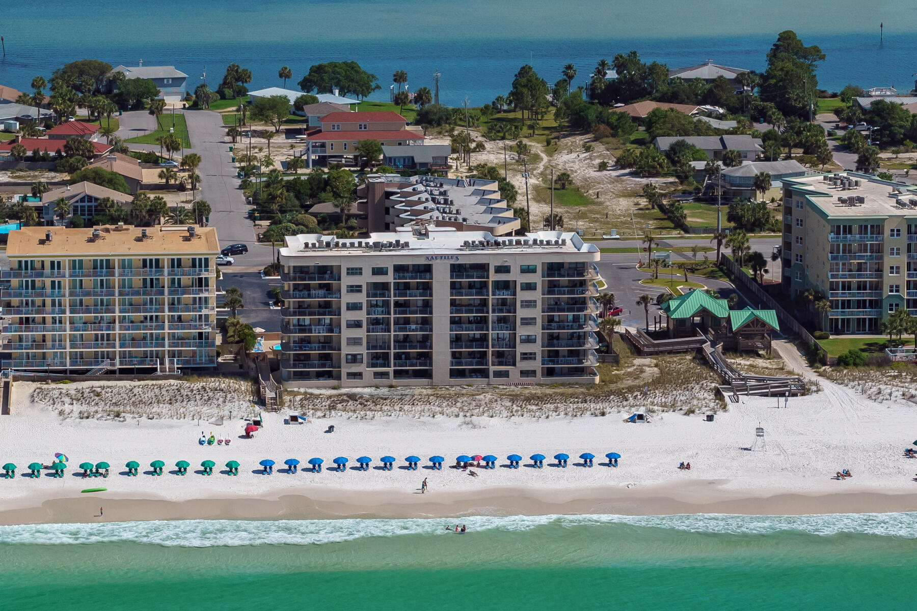 Excellent investment or second home Gulf front opportunity. The spacious wrap around balcony with updated sliding glass doors has both master bedroom and living room access and offers stunning views of the beach and sparkling Gulf waters.. Rental income for last year was $41,000 and is expected to be similar for 2024. This 2 bedroom 2 bath unit has a spacious kitchen with breakfast bar and living area. Offered fully furnished including washer/dryer and has tiled floors throughout. There is a storage room off the balcony that will be perfect for all your beach toys and equipment. The Nautilus has BBQ facilities and pool and is just minutes away from dining, shopping and entertainment venues.