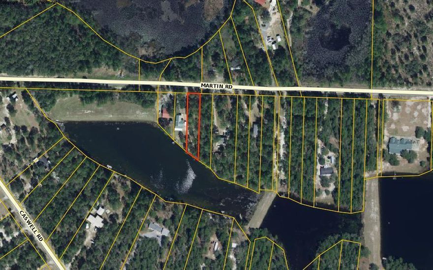 WATERFRONT LOT ON IMPERIAL LAKE! Perfect for a mobile home or build your dream home. Nice interior lot with almost 70' of waterfront on a great little fishing lake full of brim, bass, and shell cracker. This wooded lot is lightly cleared. No survey. City water is available but tap fee is due.