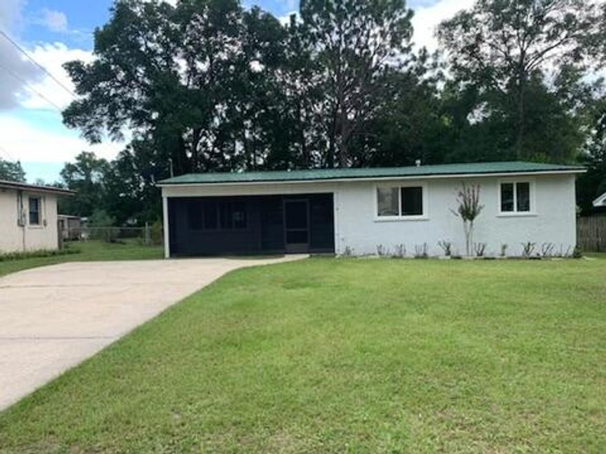 A MUST SEE!!!Home Freshly Painted inside and out.New Carpet in Bedrooms and New Refrigerator and Microwave. New Screens being installed on Windows. Large Fenced back yard with storage shed. Front and Back have Screened Porches.METAL Roof. Parking 4 Vehicles easily in Driveway. Washer and Dryer Included.  Seller Pays Title Closing at Panhandle Title Gail Wilson