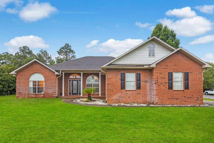 This beauty that sits on a large corner lot and features a large circular driveway with plenty of parking and extra space for a boat/RV. Inside you will find a wide open floor plan with high ceilings, all title floors and plenty of natural light. Property is also equipped and wired for a whole house generator. Master bedroom and other two rooms are on opposite sides of the house. Other two rooms are connected by a jack-n-jill bathroom and each has there own vanity and storage spaces. HVAC & HOT WATER HEATER 2017. The two car garage is oversized, with plenty of storage, high ceiling, and attic storage