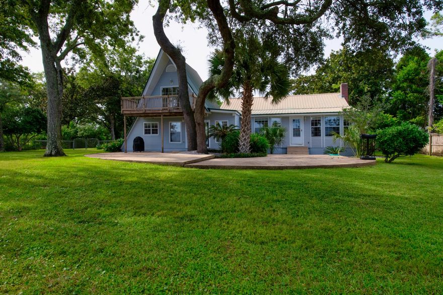 This large waterfront estate with approximately 122' on the Sound is sold 'AS IS'. Dimensions are estimated from the property appraiser website.  There is an old survey under document tab from 1991.  Large pool, boardwalk to a boat lift and mooring poles for another boat to tie up.  Property appraiser site says home(s) was originally built in 1910 and the other home that is approximately 900 sq ft  was built in 1971 .   Seller has replaced the wiring in the main home and has updated pipes.  Hardwood floors in many of the rooms, tile in bathrooms, kitchen, new LVT flooring in the bdrm downstairs.   A-Frame  was added with spiral stairs to a bedroom with open bathroom and a deck off the bedroom balcony overlooking the large back yard, pool and Sound.  A detached 24 x 36 2-car garage and