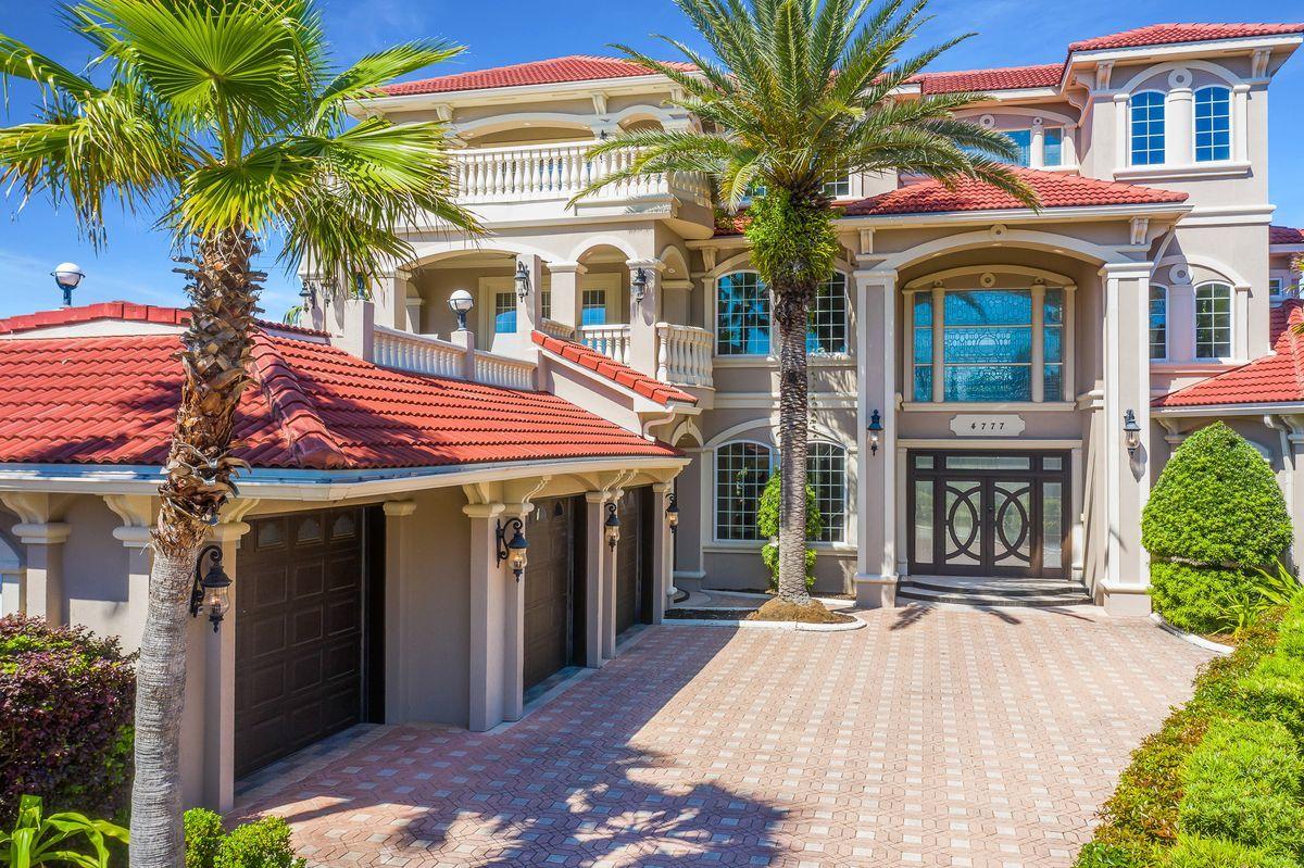 This sprawling beachside manor primely located in the gated enclave of Destiny East has been fully renovated offering an impressive three story vertical footprint with a striking Mediterranean architectural facade yielding expansive living spaces and detailed European influence throughout. Beautifully finished with designer furnishings and curated for top tier rental yield this five bedroom home allows for multiple indoor and outdoor living areas as well as $220,000 in projected annual income for 2021 (over $200,000 already booked YTD 2021).