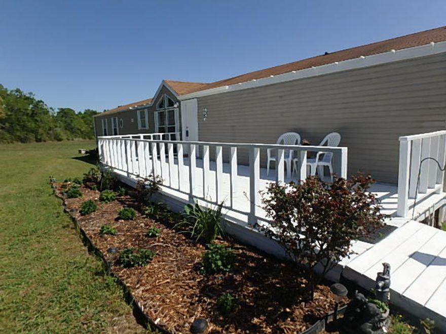 Do you like quiet? Do you want room to roam? Then this property is for you. 10 acres of cleared land, with a 3 bedroom 2 bath updated mobile home. The inviting living room greets you as you enter the home and the open floor plan is perfect for entertaining. The laundry room is hidden behind the pantry doors, and there's room for additional storage shelves or a 2nd refrigerator. The split floor plan has the master suite features vaulted ceiling, garden tub, separate shower and walk-in closet. Relax on your over-sized front deck and watch the deer as they snack in your yard. Buyer to verify room dimensions.