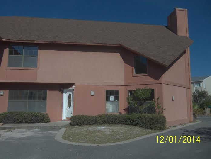 Fantastic Holiday Isle town home with harbor view. Large loft would make a great office. Upper and lower deck has been completely rebuilt. Family room has volume ceiling and a gas fireplace. New carpet. Interior freshly painted. New kitchen cabinets, counter tops and appliances. Staircase has new railings. Two master suites. DON'T WAITYOU'LL BE TOOOOO LATE