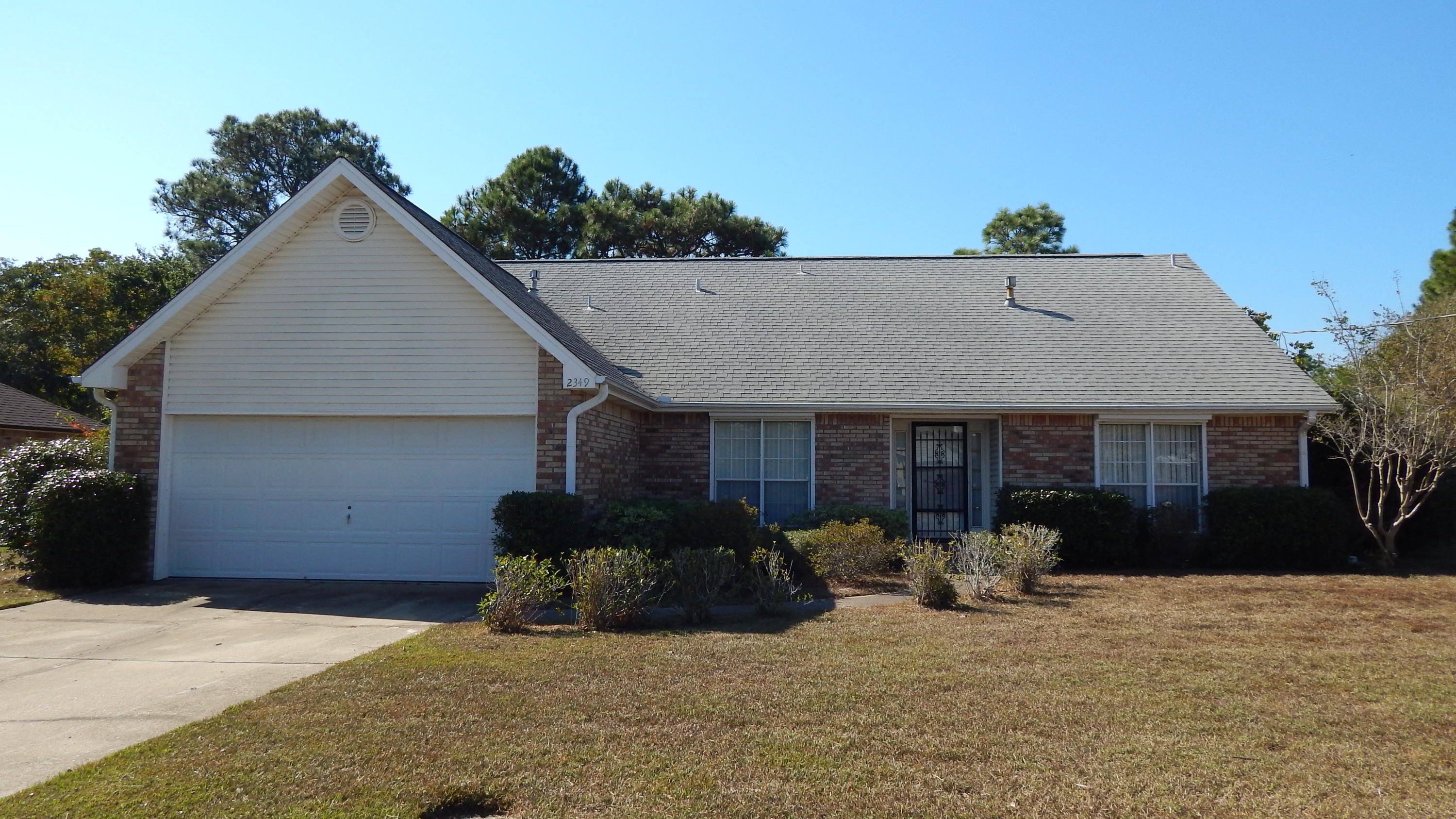 A lot of square footage for the $$$ with 5 bedrooms and 3 full baths! Located only 7 miles West of Hurlburt, this BIG, Family home is within walking distance to Wal-Mart, Navarre Beach, Hwy 87 Boat Ramp & Navarre High School! It has a functional, split bedroom floor plan: The Master, Master Bath, two additional bedrooms and extra full bath are on the first floor. There are two more big bedrooms, a functional loft and full bath upstairs! The loft makes a terrific computer room or office! This home is PERFECT for a large family. Downstairs there is Tile, Carpet and vinyl flooring. The Living Room has a Cathedral ceiling, lovely tile floor and a stone fireplace! There is a Bright, Eat-in Kitchen with tons of cabinets, an island, pantry and a breakfast nook too! There is a big Formal Dining Room at the entry that can be used as an office or playroom. Upstairs, there are two large bedrooms, one full bath and a LARGE Loft! There is attic storage and lots of linen closets and storage areas. The Master Bedroom is on the first Floor. It has a Walk-In closet. The Master Bath has double Vanities, a separate shower AND a shower/tub combo. The back yard is Privacy Fenced! There is a yard shed and hurricane shutters. There is also a Generac Whole House Gas Generator! It has not been used for a while and likely needs a new battery. Call to see this Wonderful Home Today!