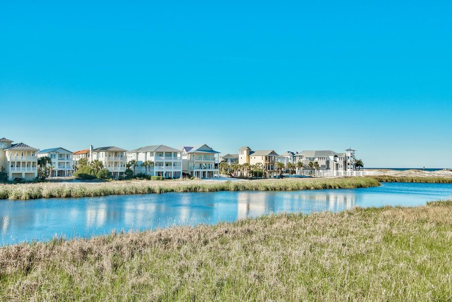 Exceptional vistas and attention to detail define this newly constructed coastal retreat. This contemporary lakefront home affords its owner with extrordinary views of lake Christina, Destin's East Pass and the Gulf of Mexico. It's well appointed and has been meticulously thought out from design to conception with its two gulf side master suites, two guest suites and additional bunkrooom with four berths which make this home an ideal retreat for large families. In total there are five and a half baths; giving each bedroom including the bunks, their own bath. Interior finishes are impressive with notable features such as tongue & groove ship lap siding, vaulted beamed ceilings, private elevator; along with wood and tile floors throughout. The first floor features an open living concept....