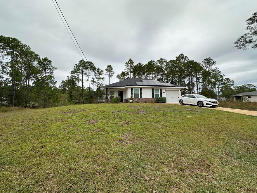 Beautifully maintained 2020-built Craftsman-style home located in the heart of Gulf Breeze. This residence perfectly blends modern comfort, energy efficiency, and timeless design all within one of the area's most desirable communities.From the moment you arrive, the home's inviting curb appeal and well-kept landscaping set the tone for what's inside. Step through the front door into a bright and open living space highlighted by a striking tray ceiling that adds height and character. The seamless flow between the living, dining, and kitchen areas creates an airy, comfortable layout ideal for both everyday living and entertaining. The kitchen is a true showpiece perfectly situated in tandem with the living room to help blend the everyday family lifestyle and hosting into one. With 36-inch upper cabinets, soft-close dovetail drawers, sleek black and stainless appliances, and ample counter space for meal prep or casual dining. Whether you're cooking for the family or hosting guests, this kitchen delivers both function and style.

The master suite offers a peaceful retreat at the end of the day, complete with its own elegant tray ceiling and a generous walk-in closet. The ensuite bathroom combines modern luxury with practicality, featuring a double vanity, a garden tub with shower, and high-end finishes throughout. Two additional bedrooms provide flexibility for a growing family, guests, or a home office.

Outside, the expansive 0.27-acre lot gives you room to enjoy Florida's outdoor lifestyle. There's plenty of space for barbecues, play areas, or even adding a pool in the future all while maintaining an easy-to-care-for yard. The quiet cul-de-sac location provides privacy and a safe environment for families, while still being just minutes from schools, beaches, restaurants and more.

This Home offers the perfect combination of style, comfort, and function in a home that feels brand new. Whether you're a first-time buyer, a growing family, or looking to downsize into something modern and manageable, this Gulf Breeze gem checks every box.
