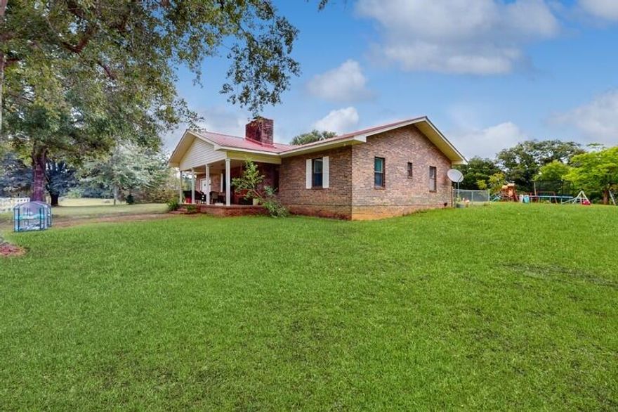 Accepting Back-Up Offers, Kick-Out Clause in place. Country retreat in Bonifay, Florida-this charming brick home offers rustic tranquility with modern convenience on 21.21 acres. just over an hour to Panama City Beach and about 35 minutes to several local springs & rivers. The home has a split bedroom floor plan, a spacious living area with fireplace, a large laundry/mud room, and a Florida room. The acreage is fenced and cross-fenced, perfect for large animals. The 1600 sq. ft. Red Iron Steel building/workshop has a 6'' thick solid concrete floor & truly offers endless possibilities. There's also a pole barn, second power pole and septic tank for potential expansion or guest accommodation. The pond was recently stocked with catfish. Spend time enjoying all this property offers! Fully Detailed Description:

Welcome to your very own country retreat! Nestled in the quiet country setting of Bonifay, Florida, this charming 4-bedroom, 2-bathroom brick home with metal roof offers the perfect blend of rustic tranquility and modern convenience. Priced at $399,900, this 21.21-acre property is an absolute gem, providing ample space and amenities for a variety of lifestyles.  If you're an outdoorsman/woman and you've thought of living in the Florida panhandle, this central location will offer a variety of just about everything you can imagine!  This home is just a little over an hour from the beautiful beaches of Panama City Beach with the most gorgeous blue-green water, perfect for a quick drive for a beach day - live in the country, play on the beach!  If you'd rather float or kayak down a beautiful crystal-clear spring, it's just about 35 minutes to Cypress Springs, Morrison Springs, Vortex Springs and Ponce de Leon Springs.  And Econfina Springs is only an hour away!  Fisherman/fisherwoman?  There are TONS of rivers and lakes within a very short drive from here! Interstate 10 is about 15 minutes away, Chipley is about 25 min. & Geneva, AL is about 20 minutes.

As you approach the property along the picturesque driveway off Bethlehem Church Rd., you'll immediately appreciate the sense of seclusion and privacy. The home, built in 1986, boasts an adorable front porch where you can swing and watch the sky color you a beautiful sunset each evening!  With its split bedroom floor plan, it's perfect for families or those who love to entertain. The spacious living area features a large fireplace, which some may consider a unique feature for Florida, but we have several cold nights each winter when having a fireplace to cozy up to can make all the difference! The seller has solid wood raised panel doors for the kitchen cabinets, ready to be installed to enhance the heart of the home.  With the exceptional aquifer system we have here in NW Florida, this home is on well water, providing pure, natural water without concerns about added chemicals. Water softener system conveys.

The home also includes a large laundry/mud room just off the comfortable covered back porch and a delightful Florida room (not included in living area SF), which opens to a small, fenced-in area - perfect for pets to enjoy the outdoors safely. For those with large animals, a green thumb or an interest in farming, the entire acreage is fenced and cross-fenced, ready for your agricultural endeavors. Chicken coop will convey.

One of the standout features of this property is the expansive Red Iron Steel building/workshop with water & electric, with its own meter. Designed with a SOLID 6" thick concrete floor (previously used for working on semi-trucks), offering endless possibilities for hobbies, storage, or a home-based business. Red shed also conveys. Additionally, the property includes a second power pole and septic tank near the front, where a mobile home was once situated - a great opportunity for potential expansion or guest accommodation. 

The pond was recently stocked (Spring, 2024) with 400+ catfish, and there is a peaceful creek that runs through the property. 

Kids or grandkids will love the included wooden playground equipment and trampoline! This property offers a rare combination of spacious land, functional amenities, and the peace of rural living, all within a short drive to some of Florida's most beautiful beaches. Don't miss out on this incredible opportunity to own a piece of paradise in the Panhandle. This home is truly move-in ready, just bring your things and start living the good life! Imagine spending your time farming, fishing, kayaking, at the beach or simply enjoying all the natural beauty that surrounds you.

Contact your favorite Realtor today to schedule a viewing and experience the charm and potential of this unique property for yourself!