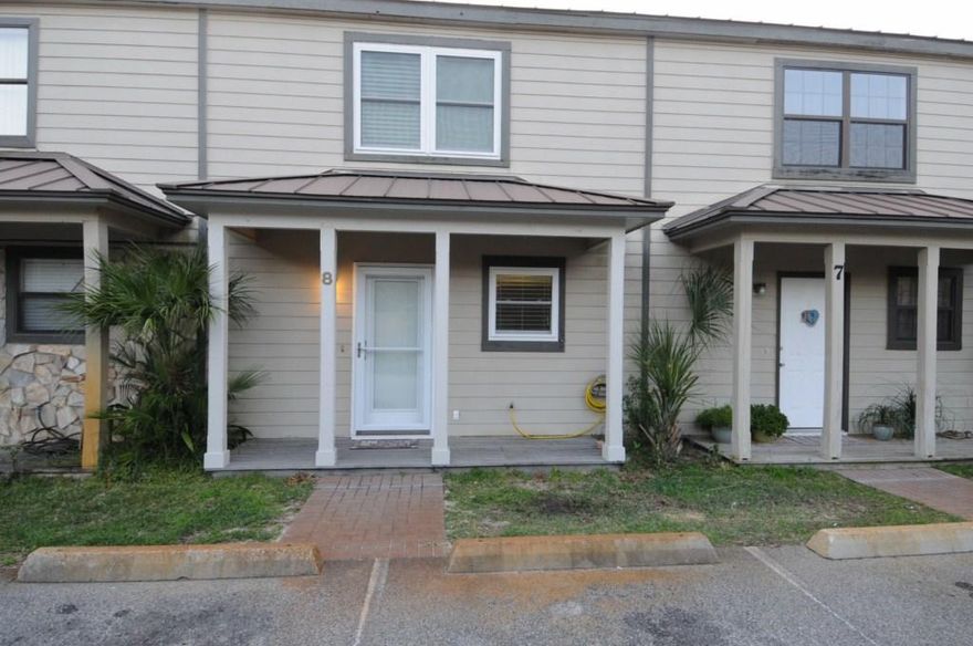 Take advantage of this rare opportunity to own an affordable, charming townhome within walking distance to the beach!  This townhome has hurricane doors and windows. A/C unit installed in 2015. A new stainless smooth-top range/oven and dishwasher installed in 2021. The back patio and privacy fence were redone in 2016. The house has tile throughout. A stair lift was installed in 2020. The stair lift is negotiable if you want it to stay. Low HOA dues. Property is under a termite contract. A MUST SEE!