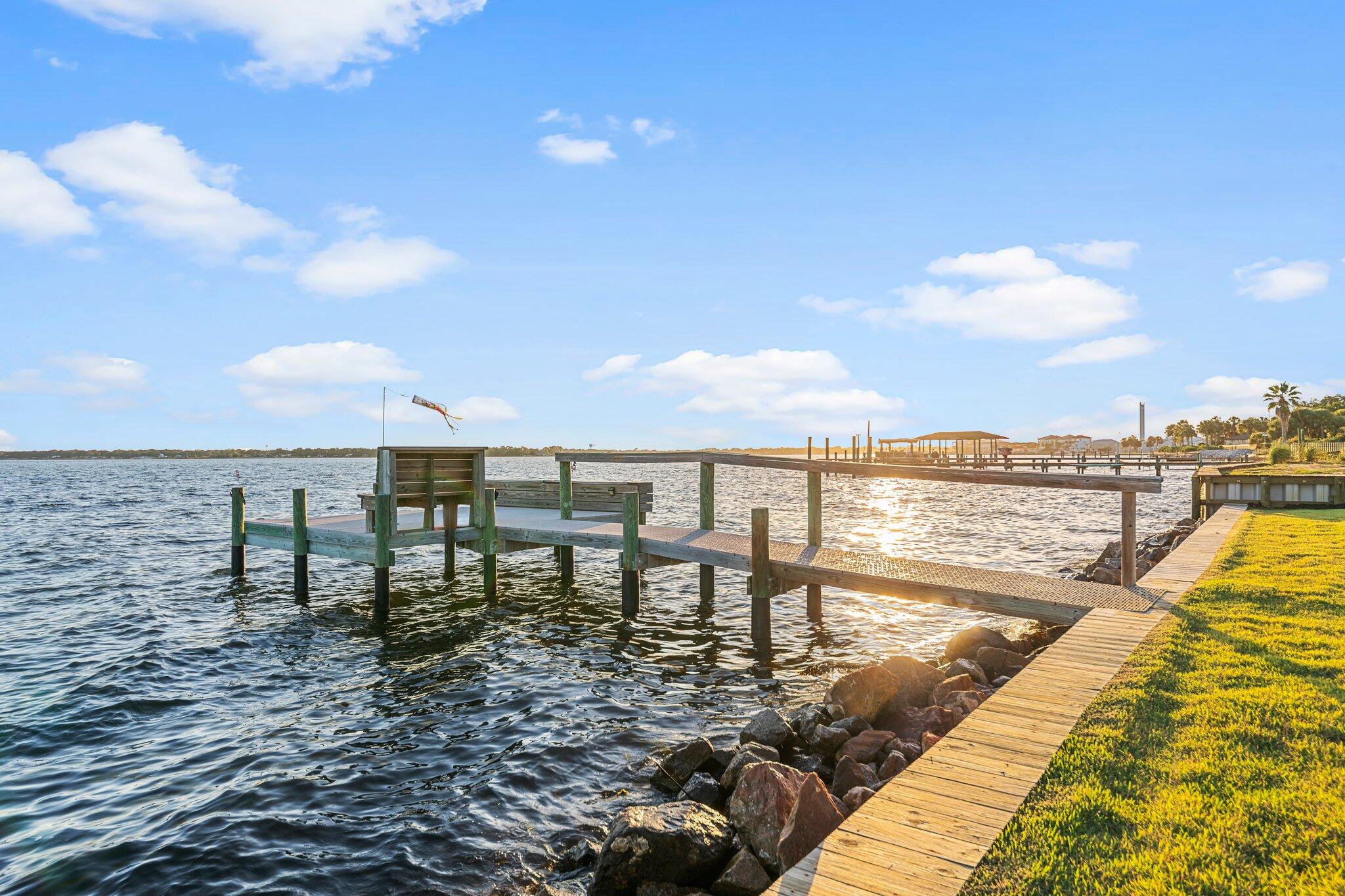 Welcome to your dream waterfront oasis in Shalimar, FL! This stunning 4-bedroom, 3-bathroom home boasts unique double waterfront views of Choctawhatchee Bay and a lagoon, allowing you to indulge in the beauty of nature from both the front and back. With convenient bay and inlet access and your own two docks, this property is a boater's paradise. Inside, expansive windows in the great room, kitchen, and wet bar area flood the space with natural light and breathtaking vistas. The master suite features a door that opens to a large patio, perfect for outdoor relaxation, along with a luxurious ensuite bathroom equipped with double vanities, a makeup vanity, and his-and-her walk-in closets. The whirlpool tub and separate shower make this ensuite your own private oasis. An additional bedroom with a private bath is ideal for guests, while a spacious bathroom serves the other two bedrooms, complete with easy access from outdoor adventures. The inviting circular paver driveway and lush landscaping greet your guests, setting the stage for memorable gatherings. Designed for entertaining, this home seamlessly connects a wet bar and expansive open areas, including a cozy brick fireplace, ensuring a perfect flow for socializing. 

This home is also located near the Emerald Coast beaches, in a quiet family friendly neighborhood with amazing restaurants near by.  Around the corner is Meigs Beach that offers a boat launch, fishing, picnic tables and a perfect place to kayak and paddle board. 

Experience the ultimate coastal lifestyle in this exquisite waterfront retreat!

* There is a second parcel of waterfront with a dock across the street that is included with this sale* 

Preferred Lender Sydney Crews @ Cross Country Mortgage. 850-499-8905.
