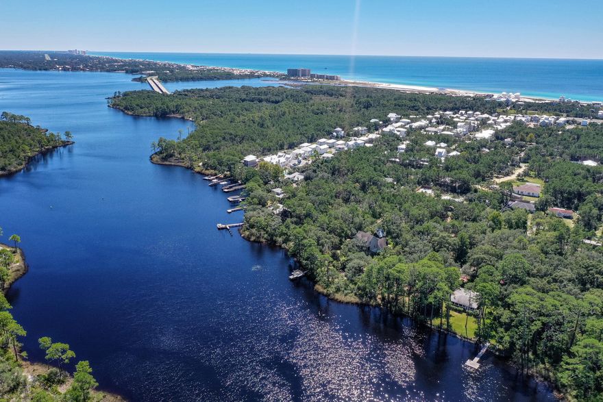 Imagine living on Lake Powell, one of the few coastal dune lakes in the entire world. Imagine living under a magical canopy of grand, mature trees. Imagine living less than a mile from the white sands of the Gulf of Mexico. Imagine all this on almost a full acre of land. In South Walton, a parcel of this magnitude and beauty, in this setting, is almost unheard of. The feeling is old Florida, yet minutes from a vibrant blend of beach and sophistication. From your lot, fish in the rare ecosystem of Lake Powell, the largest coastal dune lake in North America. Boat through Lake Powell's outfall directly to the Gulf. Moments away, find the top echelon of dining and shopping on 30A. This is an unrivaled setting to create the home of your imagination. This is the opportunity of dreams.