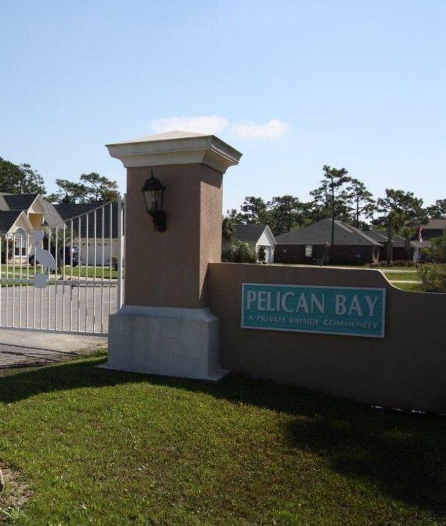 Pelican Bay is a beautiful, gated subdivision located just minutes from shopping, restaurants, movie theaters and the beach. Owners in Pelican bay enjoy playing tennis on the owners tennis courts, picnicking in bay front picnic area or fishing off the dock. You can enjoy this too - Come build your dream home on Windspray Court in Pelican Bay - NOW. Buyer to verify dimensions if important.