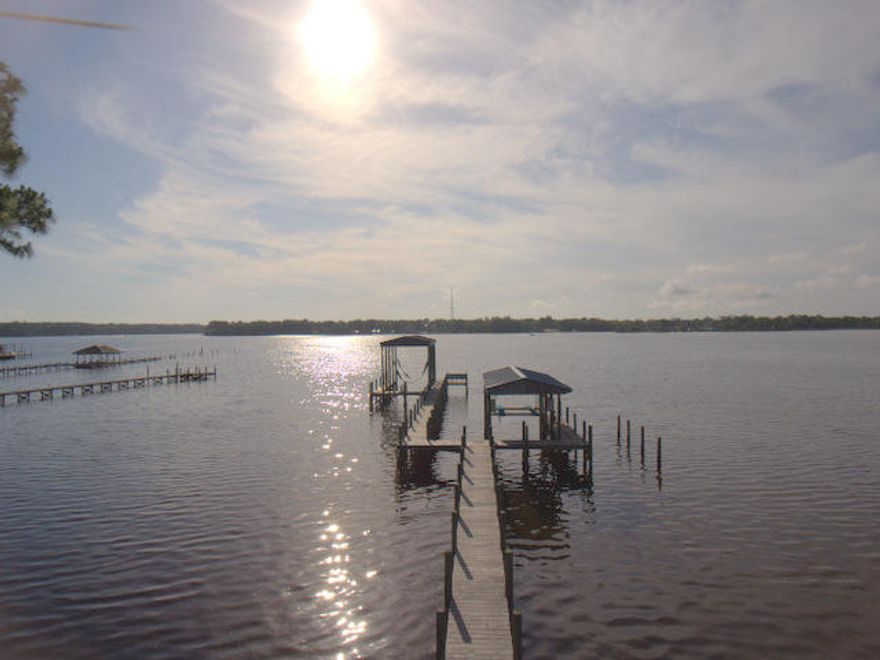 Beautiful WATER FRONT home with incredible views of Choctahatchee Bay and Rocky Bayou. This 3 Bedroom, 3 Bath home comes with a boat dock and lift. The home is complemented with a 30 year metal roof, hardi siding, bamboo flooring, expanded driveway, updated kitchen with new cabinets and granite countertops, new backsplash, Rinnai hot water system, new ventilation duct work, new light fixtures, new interior paint, and best of all, the popcorn has been removed from the ceilings. The back yard has a large patio and sea wall, plenty of room for entertaining. The master bedroom has its own balcony as well with unobstructed water views. There is a shared dock that leads to a separate boat lift and dock for each owner. There is an Shared Dock Agreement in place that transfers with the home.