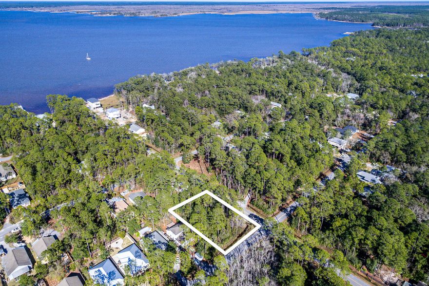 Calling all builders - The best priced double lot in all of Point Washington!  Magnolia Beach is a highly desirable Bayfront community with no HOA, a boat ramp, and deed restrictions in place that do not allow mobile homes.  Minutes from the white sandy beaches in Grayton Beach.  This community is perfectly situated in Santa Rosa Beach to easily get to shopping, restaurants, the Panama City Beach international airport, boating and beach!