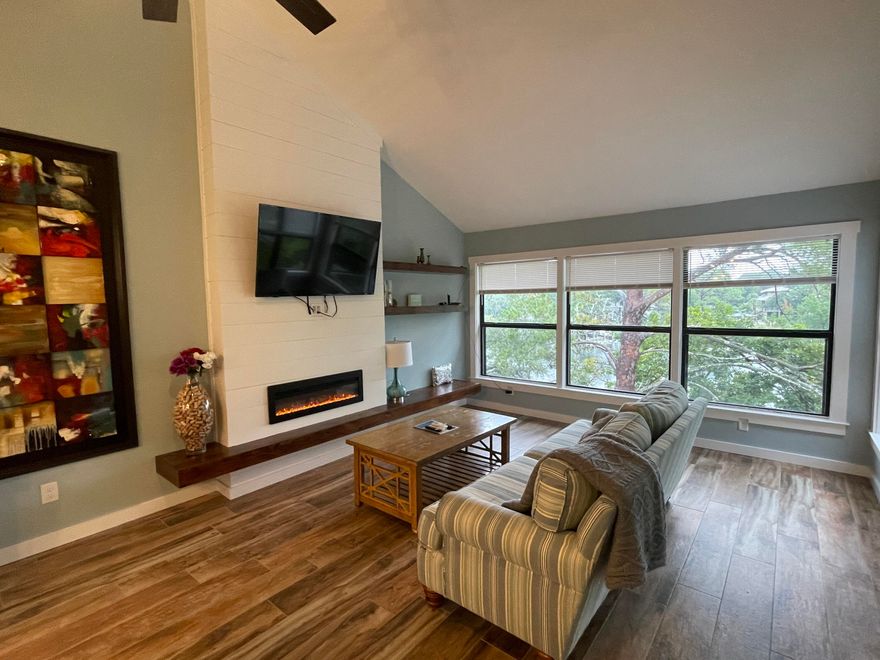 Absolutely stunning, fully renovated 2-bedroom waterfront condo in Bluewater Bay, perfectly situated on Wards Cove at the Marina next to LJ Schooners. This incredible home features an open-concept floor plan with a modern, fully equipped kitchen boasting a huge island, stainless steel appliances, including a sleek flat cooktop stove, and abundant cabinet and counter space. The spacious living area opens through sliding glass doors onto a screened-in balcony with serene water views, ideal for relaxing or entertaining. On the main level, you'll also find a full bathroom and a convenient stackable washer and dryer. A beautiful spiral staircase leads to the second generously sized bedroom, offering privacy and charm. Enjoy the best of coastal living with nearby beach access and a boat launch just moments away. Pets may be considered on a case-by-case basis with prior owner approval and a non-refundable pet fee. No smoking, including vapes.