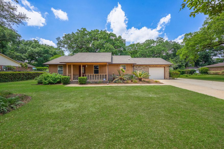 Situated on a tree-lined street in the heart of Pace just off Highway 90, this inviting 3-bedroom, 2-bath home offers a perfect blend of charm and convenience! The property is highlighted by a majestic live oak and a covered front porch, providing welcoming curb appeal. Step inside to a bright and airy living room featuring a cathedral ceiling, wood beam accent, skylights, and a set of double doors that flood the space with natural light and lead directly to the backyard. The kitchen provides ample cabinet space and flows seamlessly into a spacious dining area, perfect for gatherings and family meals. The split floor plan offers privacy, with the primary suite tucked away from the other bedrooms. It boasts a large vanity, walk-in closet, separate shower, and water closet. The additional two bedrooms are located on the opposite side of the home with a shared full bathroom featuring a tub/shower combo. Outside, the possibilities are endless. The long driveway offers plenty of parking for multiple vehicles, a boat, or even an RVno HOA restrictions here! A one-car garage is complemented by a carport accessible via a double gate to the backyard. You'll also find a 23x23 workshop complete with built-in shelving and a bay door, perfect for hobbies or storage. The backyard is shaded by another beautiful mature oak tree and offers plenty of space for entertaining or relaxing. Whether you're a first-time buyer or looking for a great investment opportunity, this home's layout, charm, and central location make it a must-see!