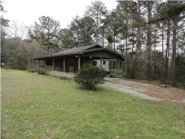 This charming custom home is situated on five partially wooded acres complete with it's own meandering creek! The home has many custom features through out. There are two fire places, one in the living room and one in the master bedroom. Enjoy the wildlife from the large front porch and views of Alaqua Creek from the Florida room in the back. Enjoy the serenity of a country home while still being only minutes away from Defuniak Springs.