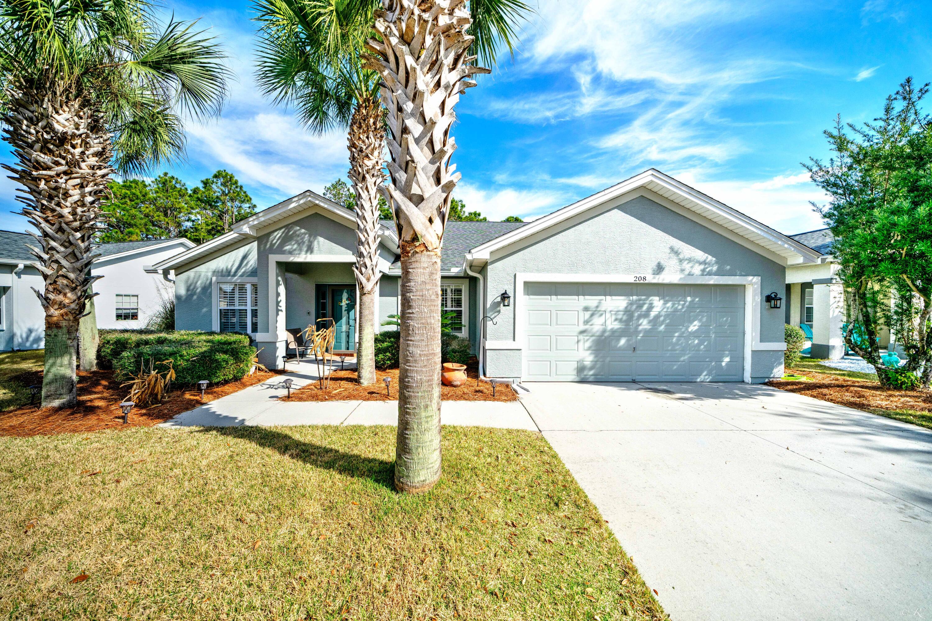 Welcome to 208 Bainbridge St, well-maintained, 4Bed / 2 Bath, Palmetto Trace beauty! Neighborhood amenities include 2 pools, sidewalks, street lamps, golf cart friendly, walk to Pier Park, Frank Brown Park, and the Emerald Green Gulf of Mexico. Enter the home to a formal living/dining area w/ an easy transition to a large great room. There are plantation shutters in both the living room and breakfast nook. The eat-in kitchen has granite countertops. This home also features vaulted ceilings and a split floor plan. The master bedroom is quite spacious with his/her closets and double vanities. Both bathrooms have solid surface countertops. There is no carpet in the home: hardwood in the front living area and master bedroom, laminate wood flooring in the 3 bedrooms, and tile throughout. Roof, water heater and exterior paint all new as of 2022.