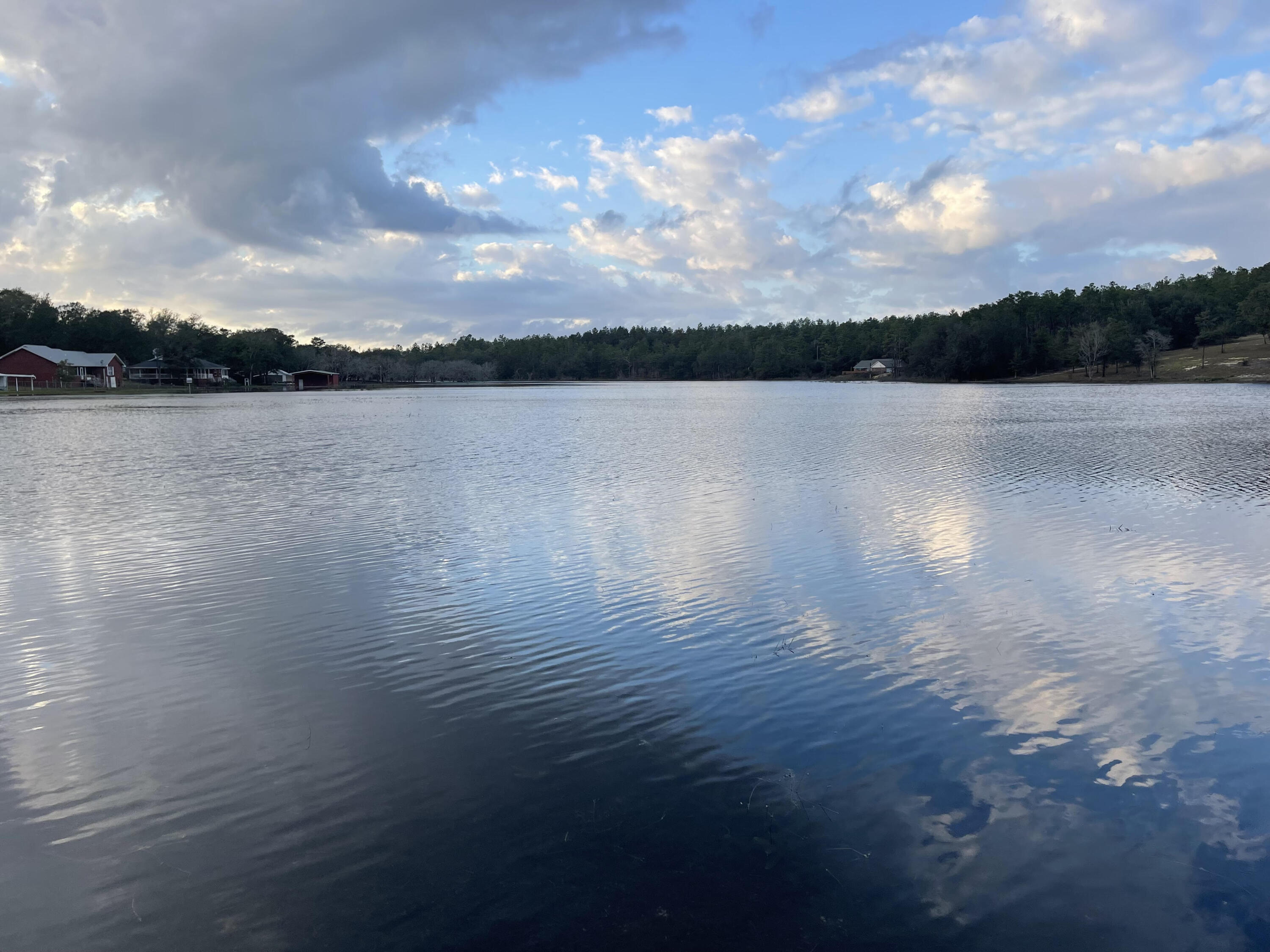 Large lot ON THE LAKE! 12.6 acres no enjoy the sunset views year round over Piney Lake. You can subdivide the property into three 4 acres parcels. Rezoning as low density residential is an easy process. Getting financing for over 10 acres requires a special loan type and we will entertain approved offers. A well looks to be already drilled on property but it has not been tested (see pictures). Address right next to this property is 2073 Rolling pines is to the west of this property to help you locate it. Wide Trails on each side of the property line from the road are wide cut and many paths and trails cut through the closer you get to the water to help explore. Currently many planted pines on it and some beautiful large oaks at the water line