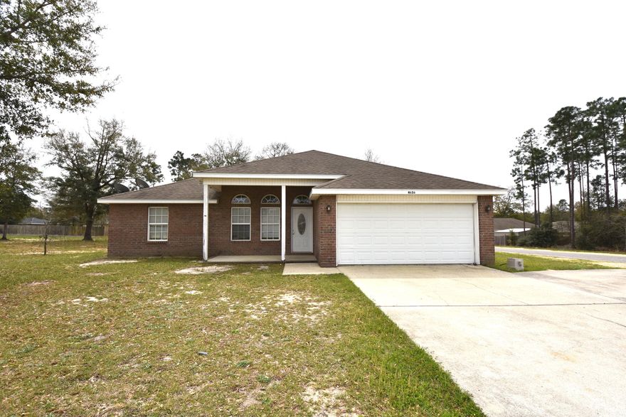 Priced right and easy access from Mossy Head or Crestview. Hwy 285 is a convenient way to & from Eglin AFB, avoiding Hwy 85. Vaulted ceiling and built-in TV/Stereo space accents the Living Room. Popular split Bedroom plan & open floor plan give a sense of spaciousness to this home. Just a few minor repairs would make this a nice home for you! Large, level corner lot. 2-Car garage. House has frontage on Camellia Avenue, a paved road, and Canary Circle, is a dirt road. Take a look today!