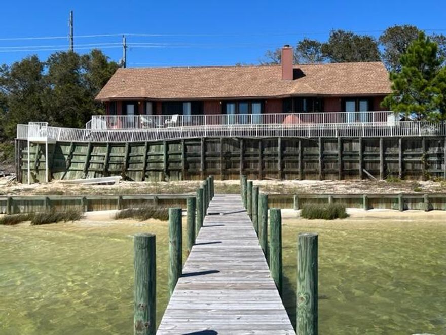 Cash offers only.  Seller will not consider offers contingent on sales or refinancing. 1% EMD Requested.  Diamond in the rough with Lots of Potential!  This home needs a little bit of TLC and is being sold As-Is / Cash Offers only.  94' of Water Frontage on the Intercoastal Waterway!  4 Bedrooms when counting the 29' long bonus room upstairs!  There are two baths downstairs, both with walk-in showers.  Beautiful Water views from the Master Bedroom, Living Room and Kitchen!  There is a Long Screened Porch across the entire front of the home!  The Eat-In Kitchen is bright with abundant oak countertops, Jenair stove top, wall oven and microwave.  There is a 4th bedroom/Bonus Room upstairs. The Office, Master Bedroom/Bath, two additional bedrooms and guest bath are downstairs