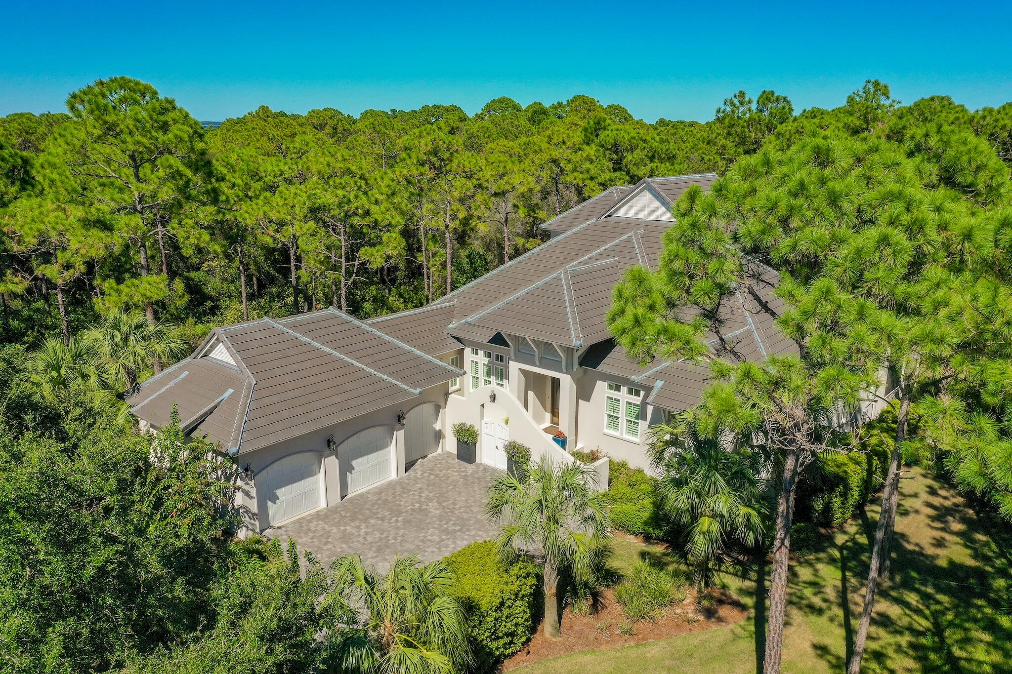 This Beautiful Home still looks and feels Brand New! It has been used as a second home and has been very well maintained! Hickory wood flooring, plantation shutters, Kohler plumbing, plenty of  storage and tons of natural light are features you will see throughout the entire home! The Chef's kitchen features, Quartz countertops, an oversized Quartz Island, 48'' Thermador Gas Range/Oven Combo, Sub-Zero refrigerator, polished nickel fixtures, extra large walk-in pantry, and a wet bar with an icemaker. Other features you'll find on the 1st floor include, master bedroom, guest bedroom with large bathroom and walk in closet and a full office. Additional features include a custom cast concrete mantle and fireplace, a 12ft. coffered foyer entry with reclaimed solid wood detailing,