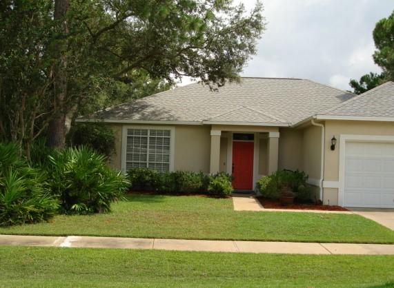This immaculate home in Indian Woods subdivision has been exceptionally maintained. This home is spacious with 9 foot ceilings throughout and upgrades to include a new roof, AC, water heater and porcelain floors throughout. The kitchen includes a Kenmore side by side refrigerator, garbage disposal, Santa Cecilia Gold granite countertops, Kohler porcelain sink with new single handle faucet and a Bosch dishwasher. Outside on the back porch is a new screened patio to enjoy quiet mornings and late evenings. Other improvements include new lighting, hardware, toilets and because there are so many new improvements I have compiled a list of all the new features. The colors in this home are soft neutrals and will go with any dcor. Home also has wood burning fireplace and is Flood Zone X. Must see!