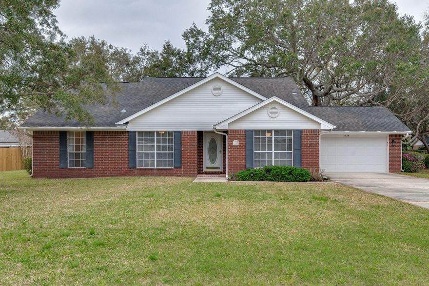 Tucked away in a quiet neighborhood with no HOA, this 3/2 home is everything you're looking for!  The open floor plan offers plenty of natural light and room to fill and make your own.  The generously sized kitchen has extra countertop and cabinet space and a breakfast bar, with its own breakfast nook.  You will also find a separate dining area that can also be used as a play space, home gym, an office nook, or whatever you need! The master bedroom has a large ensuite master bath with double vanity, separate shower and tub and walk-in closet!  You will also find a set of french doors in the master bedroom that leads to the open patio.  Add some fairy lights and the backyard could be your own private retreat with its towering oaks and flowers!