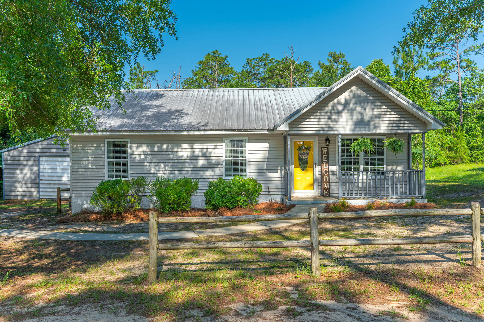 Welcome to this delightful ranch-style home nestled just minutes from the heart of Crestview! Sitting on a generous .4-acre lot, there's plenty of room for kids and pets to play, explore, and enjoy the outdoors. Inside, you'll find no carpet just easy-to-maintain tile and laminate flooring throughout, making this home as practical as it is inviting. Whether you're relaxing in the cozy living space or cooking in the kitchen, this home offers comfort and functionality at every turn. The real bonus however is the massive 24x40 metal shop with a roll-up door making the perfect place for hobbies, projects, extra storage, or your dream workshop setup!Don't miss out on this unique property that offers space, convenience, and endless possibilities all in a prime Crestview location!