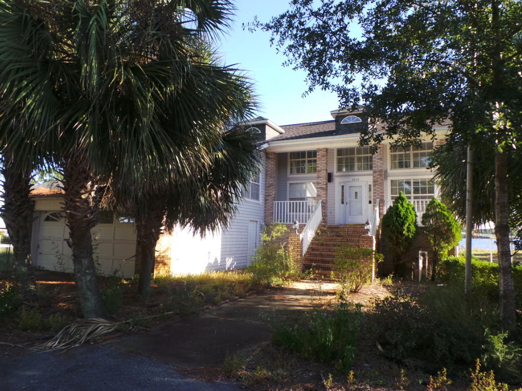 Waterfront! Own your own slice of paradise on East Bay in this traditional style 2 story home on half an acre. Home features over 2700sqft of floor plan, 28ft ceilings, wood burning fireplace and tons of natural light. Eat-in kitchen is spacious and offers, refrigerator, dishwasher, gas stove top/oven and built-in microwave. Bring your toys; there is plenty of storage space for everyone's things!! Plenty of storage with the attached 2 car garage and large metal building. Top it off with a seat in the gazebo, glass of wine and the sunset on the bay. Boat house, and boat slip and one gazebo are not included with this house.