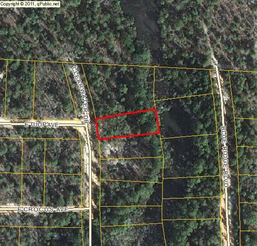 Nice wooded lot on small creek. Close to town, beaches, and interstate.