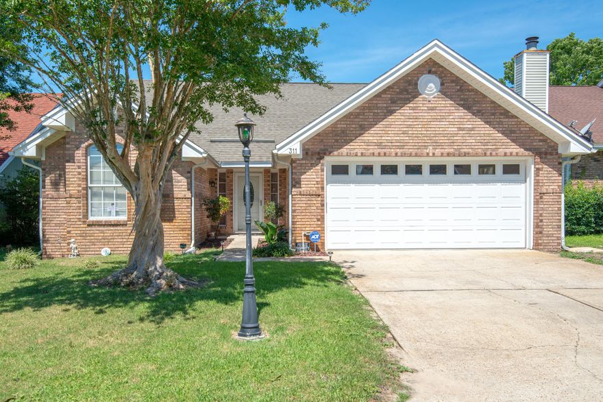 CUTE AS A BUTTON! This home is a must see at only $184,900, being just west of Hurlburt Field AFB, minutes to the beaches and on a dead end street! This adorable 3bed/2bath home with 2 car garage features cathedral ceilings, wood laminate flooring throughout and fresh paint. The master suite offers a lot of natural light and double vanities, large walk in closet and a tub/shower combo in the bathroom. The dining area has a great view to the living room and an abundance of windows for great natural lighting. The kitchen features stainless appliances with built in microwave and newer smooth cooktop stove. The quaint back yard offers a covered patio area and fenced in yard. This home is a much see for this price point, so call today to schedule a showing!