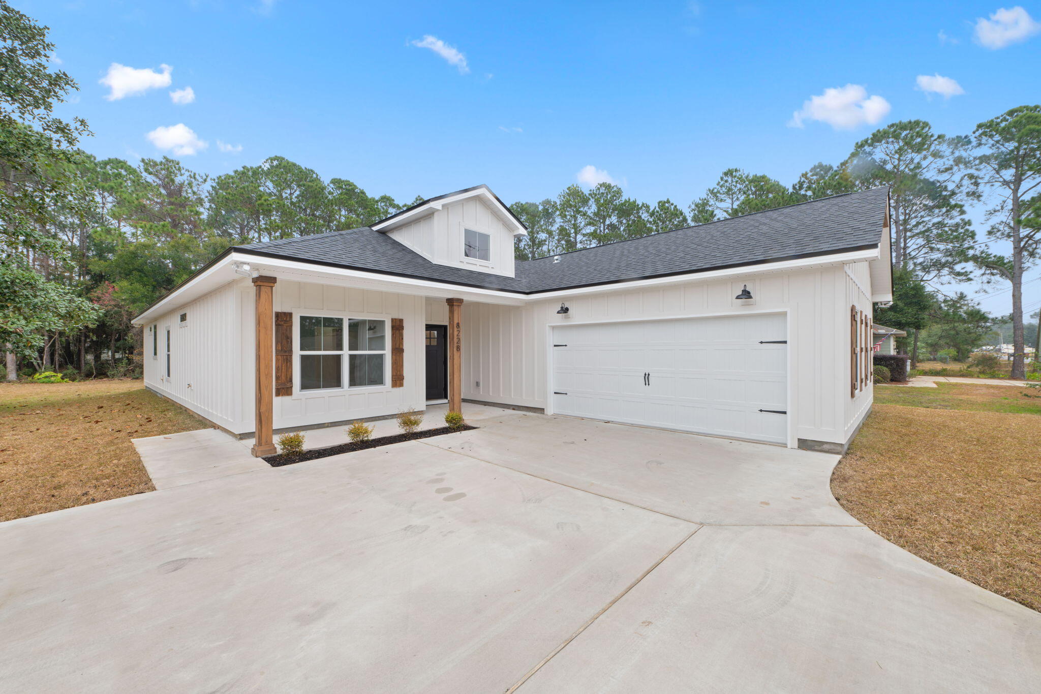 NO HOA, 5 minutes to Navarre Beach! This semi-custom home offers 1965 square feet of spacious living with 4 bedrooms, 2.5 bathrooms, and an expansive oversized backyard! The home's standout features include custom cypress wood beams and vaulted ceilings, adding warmth and character to the already beautiful design. The walk in pantry, gas range, and side-entry garage make for a modern and comfortable living experience that you'll enjoy every day. Don't forget your gas fireplace to cozy up to on those chilly overcast days! The master bathroom boasts a luxurious free-standing tub and beautifully tiled shower, offering a spa-like experience at home. You'll never have to worry about running out of hot water with the tankless water heater - a feature that will surely impress. This is not your average builder-grade house - it's a true gem with curated designer fixtures and finishes. With a focus on personalized service and attention to detail, you can trust that your home-buying experience will be second to none. Contact us today to learn more about how you can make this house your forever home! Estimated completion Oct 2025