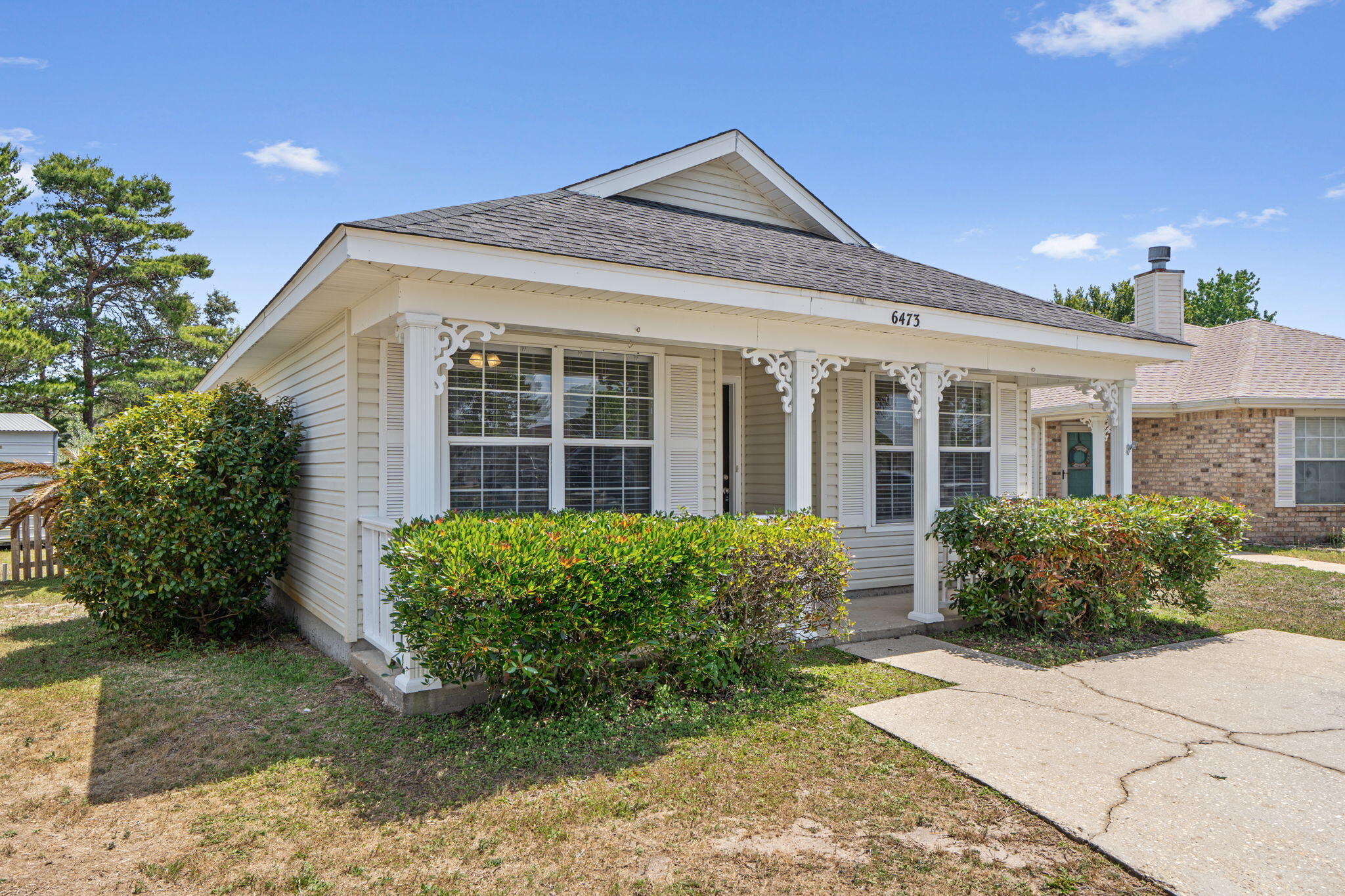 Cutest Florida Cottage with a large and shaded back yard. All new LPV flooring throughout; money saving natural gas used for heating/cooling and HW tank. 3 Bedrooms and 3 Baths, Master bedroom with a large master bath that includes a double vanity, shower and walk in closet. The two other bedrooms are at the front of the house with nice double windows, The full bath has been remdeled and has a tile tub/shower enclosure and linen closet. The back yard offers privacy and room for a gardenor two, plus an oversied shed that could double as an art studio or she shed. The subdivision offers a kids playground and water/beach access along the Santa Rosa Sound. Call today for an appointment to view.