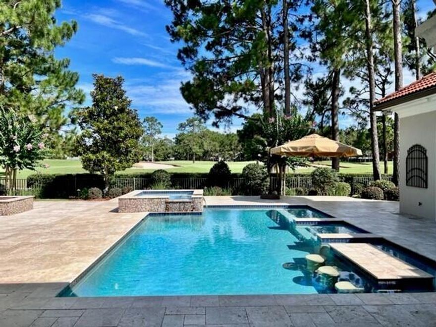 This one-story Mediterranean style pool home is situated on the 2nd fairway of the Raven Golf Course checks a lot of boxes for today's homebuyers! Well-maintained home with beautiful pool/spa/firepit, and outdoor kitchen with full pool bath. This is a home for entertaining...and pool has a swim up bar and you can watch the big game while you're in the pool! Floor plan has high ceilings with 2 Master Bedrooms with easy access to the pool area.  All bedrooms have ensuite baths and office has a closet. There is a 3-car garage giving you a place to park your golf cart comfortably. Wonderful neighborhood in Sandestin and you can golf cart to the beach, the Baytowne Marina, and lots of good restaurants and shopping. It's a fun lifestyle here in Sandestin and this is a wonderful neighborhood!
